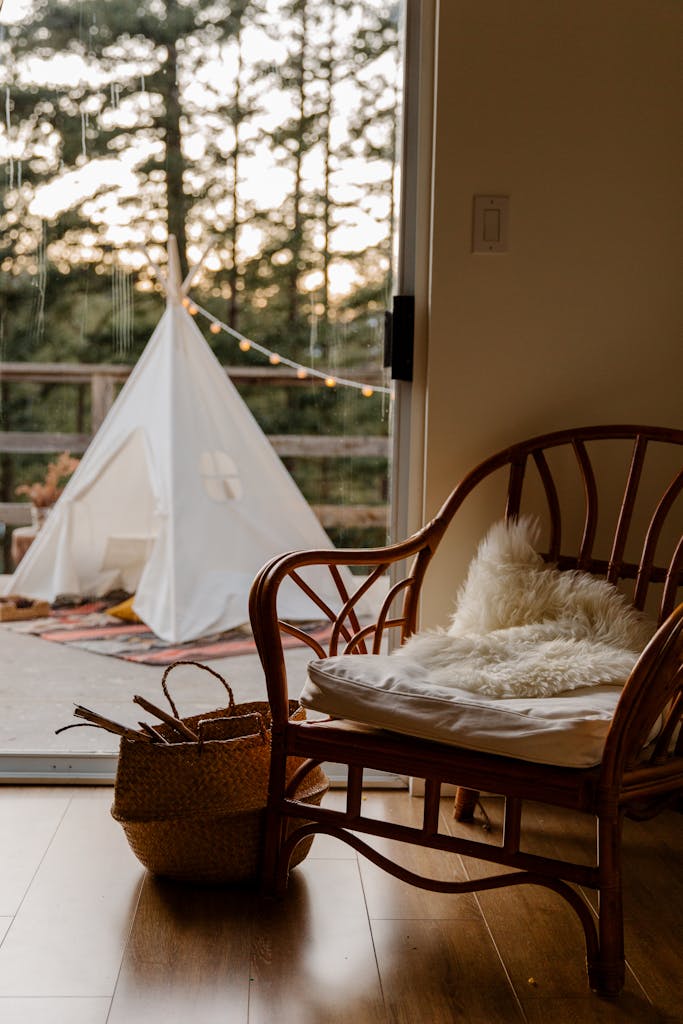 Interior of room with wicker furniture and wigwam on terrace